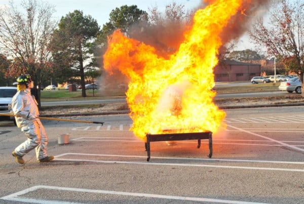 A fire exploding from a deep fryer