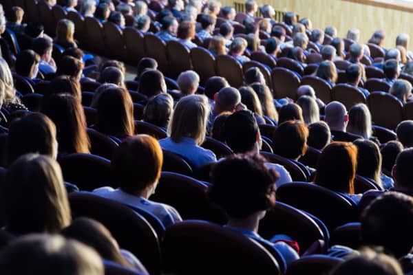 An audience in an assembly occupancy