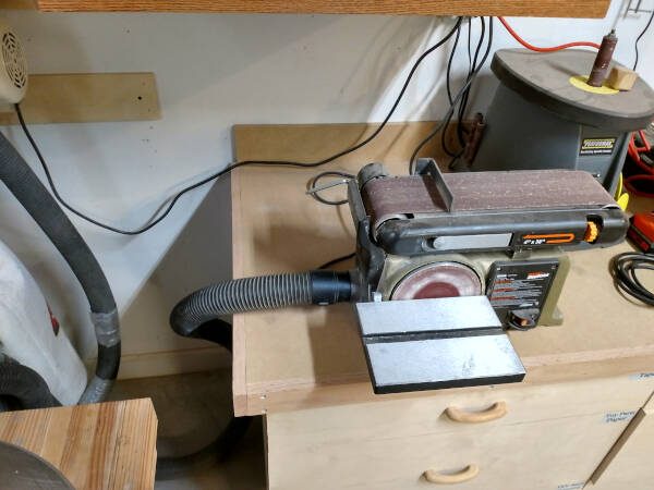 Dust collector hooked to bench sander